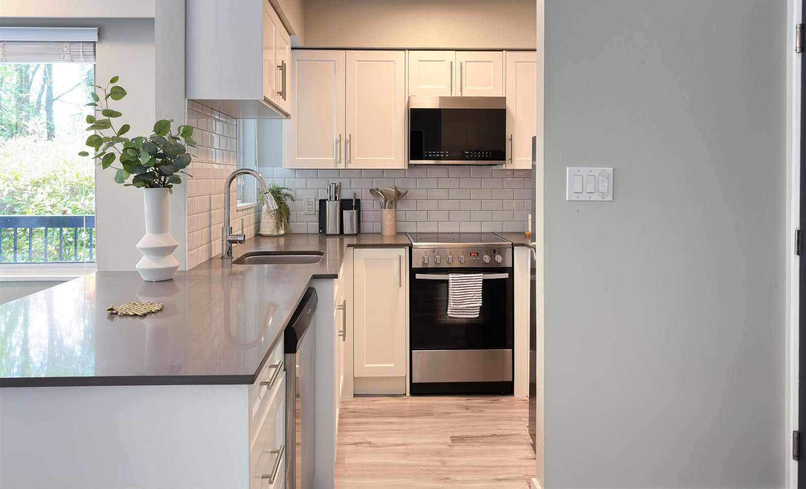 cleaning kitchen in Commercial Drive, East Vancouver